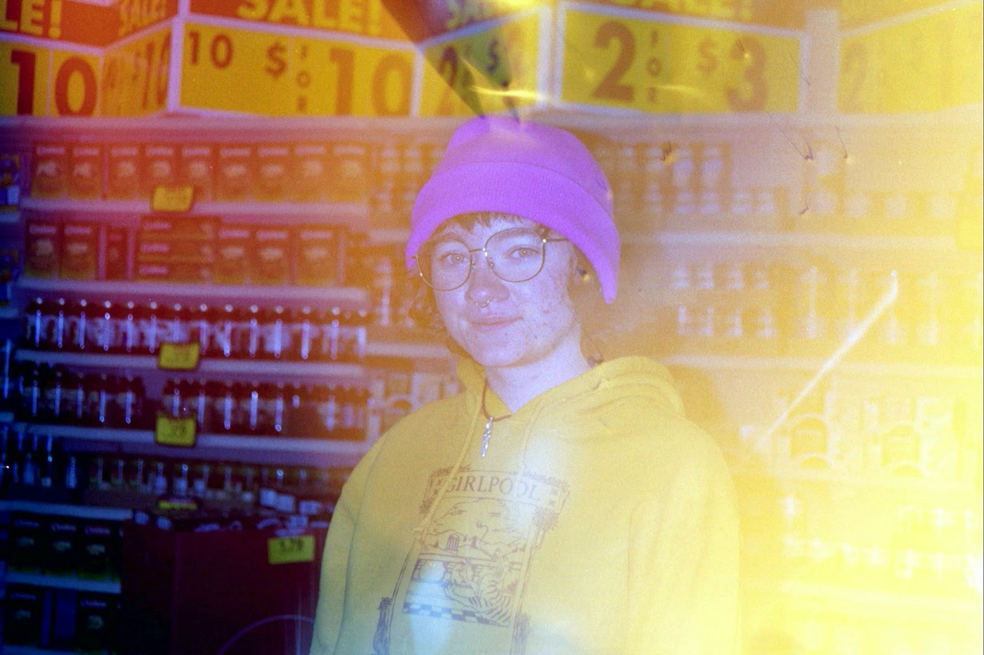A photograph of a model in a supermarket, with a yellow flash effect on top.